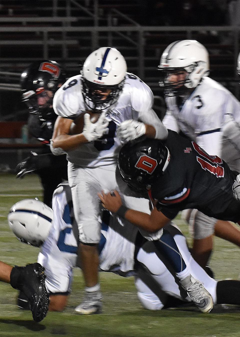 Somerset's Ashton Khoury (9) tries to get past Durfee High defense during last season's football game at B.M.C Durfee High School.