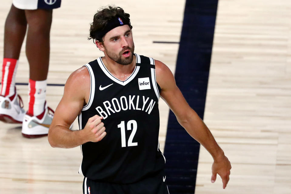 LAKE BUENA VISTA, FLORIDA - AUGUST 02:  Brooklyn Nets forward Joe Harris #12 reacts after a play against the Washington Wizards in the second half of a NBA basketball game  at HP Field House at ESPN Wide World Of Sports Complex on August 2, 2020 in Lake Buena Vista, Florida. NOTE TO USER: User expressly acknowledges and agrees that, by downloading and or using this photograph, User is consenting to the terms and conditions of the Getty Images License Agreement.  (Photo by Kim Klement-Pool/Getty Images)