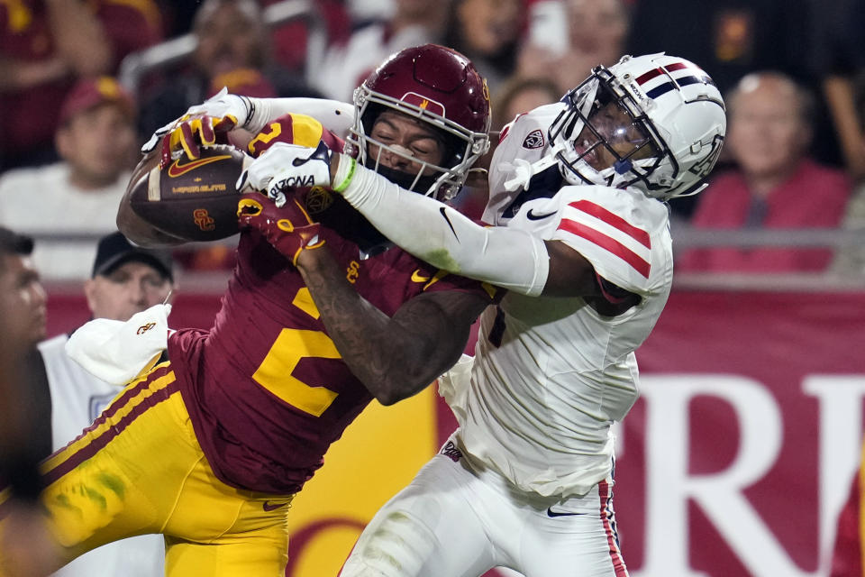 Southern California wide receiver Brenden Rice (2) makes a catch as Arizona cornerback Ephesians Prysock defends during the first half of an NCAA college football game Saturday, Oct. 7, 2023, in Los Angeles. (AP Photo/Marcio Jose Sanchez)