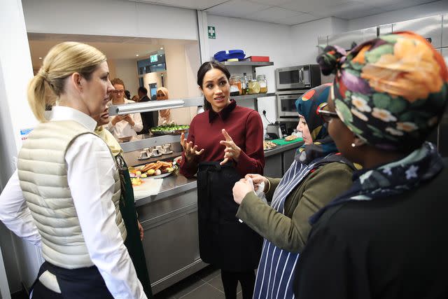 CHRIS JACKSON/AFP via Getty Meghan Markle at the Hubb Community Kitchen in 2018.