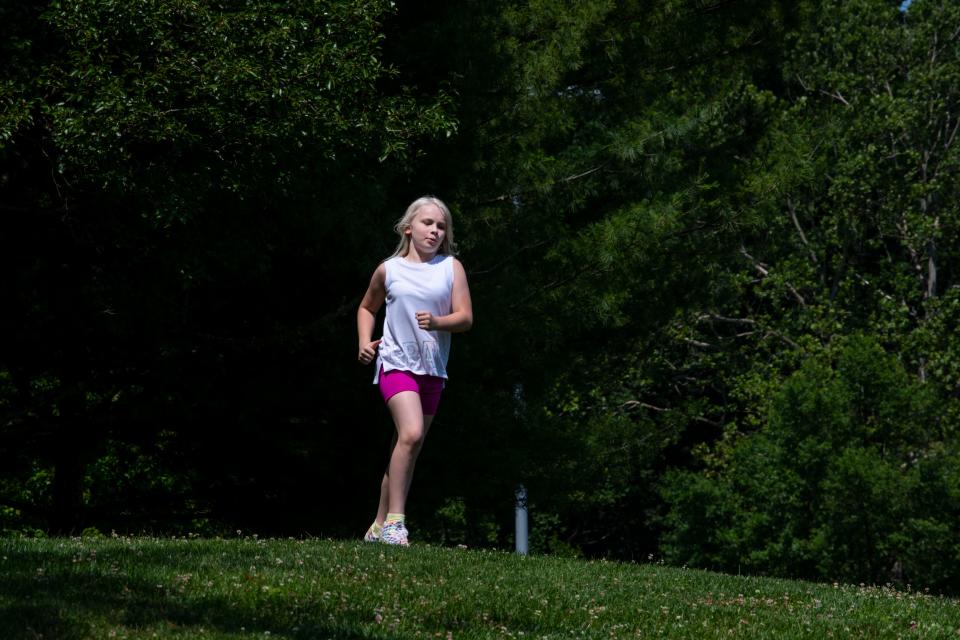 Becky running in Bridgeport, West, Virginia. (Photo by Raymond Thompson Jr)