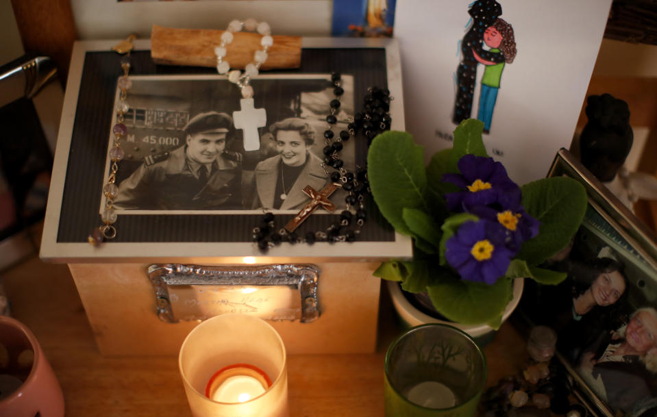 The cremated remains of Martha Pedrotti, the mother of Fernanda Mariotti, stand inside an urn at her home in Buenos Aires, Argentina, Tuesday, Aug. 11, 2020. Mariotti insisted that the doctor treating her mother allow her to see her at the hospital as she fought COVID-19, because she could calm her down. But she always came up against the same answer, like an insurmountable wall 'You can't, it's protocol,' They told her. "How do we justify such a lapidary protocol? This protocol is more harmful than the virus," she said. (AP Photo/Natacha Pisarenko)