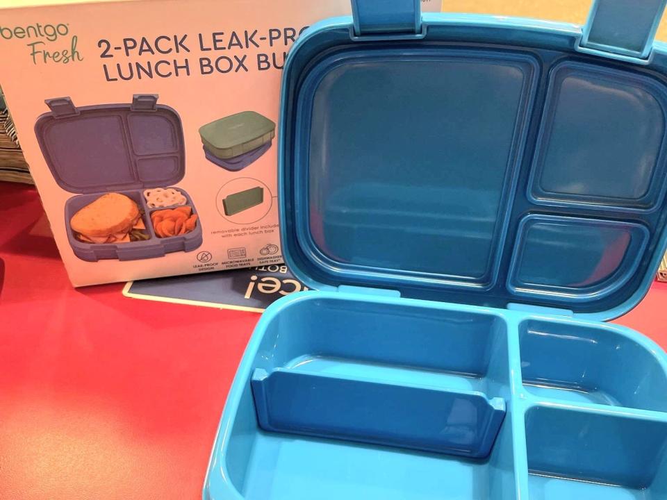 A blue Bentgo lunch box with removable compartments.