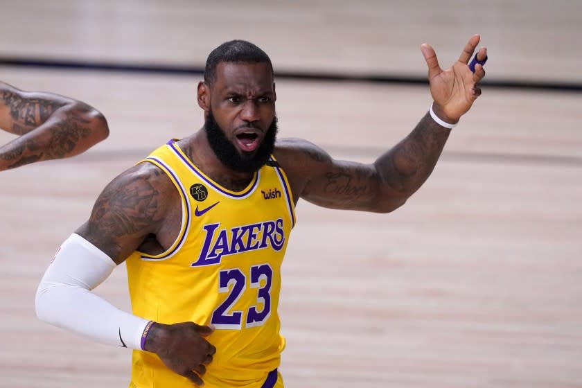 Los Angeles Lakers forward LeBron James shouts in the direction of an official during the first half.
