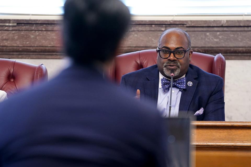 Byron Stallworth, chair of the Planning Commission, asks a question of Cincinnati Mayor Aftab Purevel, foreground.
