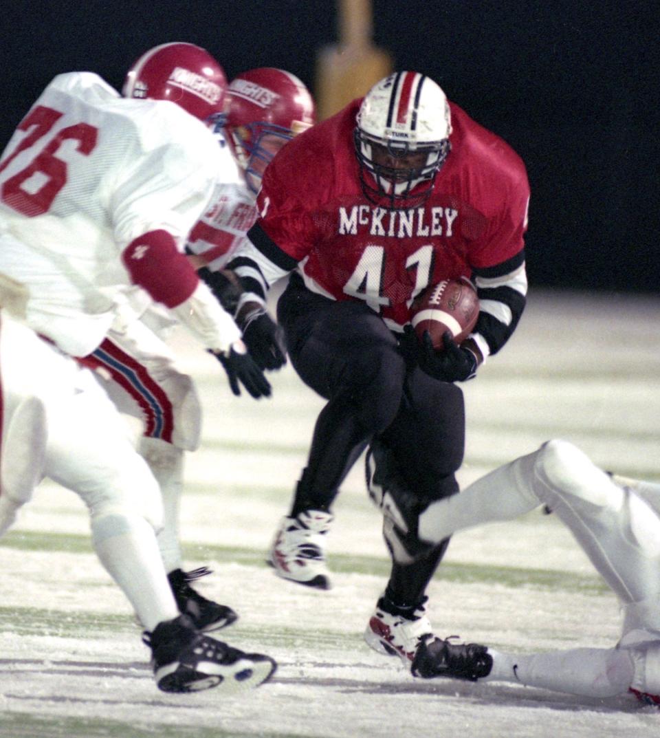 McKinley fullback Jamar Martin runs the ball against Toledo St. Francis DeSales during the Division I regional final at Byers Field, Saturday, Nov. 15, 1997, in Parma.