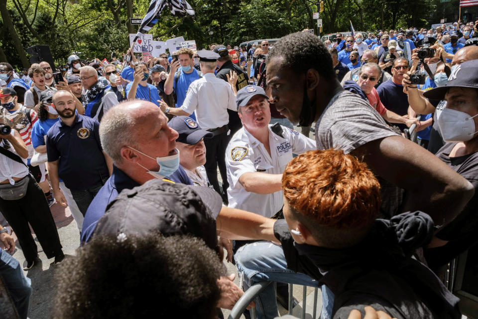 Black Lives Matter protesters argue with NYPD officers near New York City Hall, Wednesday, July 15, 2020, in New York. (AP Photo/Yuki Iwamura)