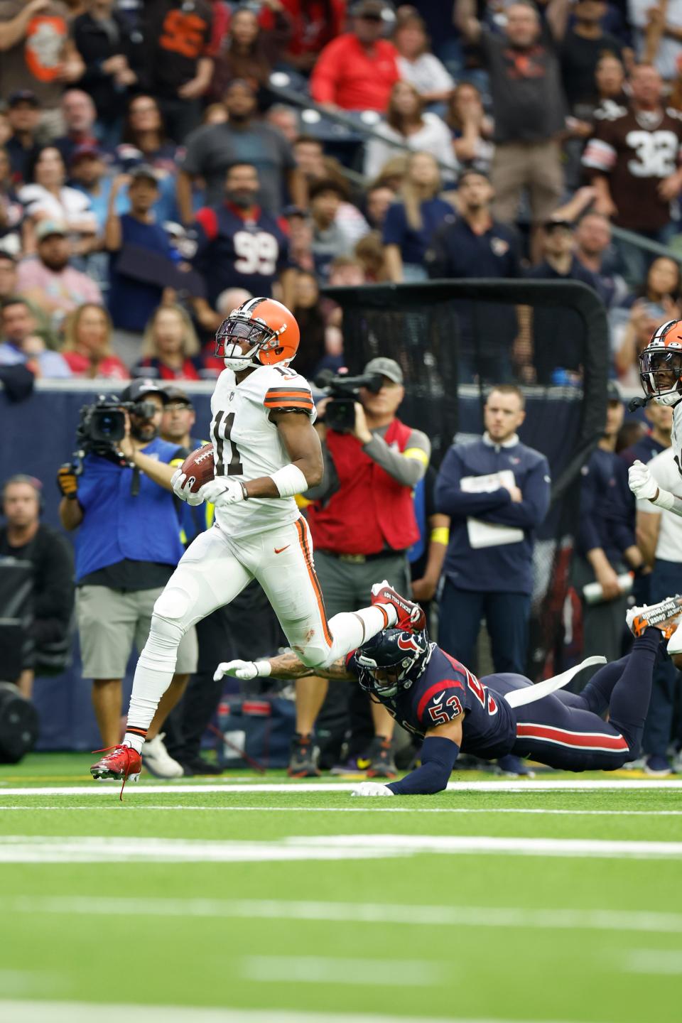 Cleveland Browns wide receiver Donovan Peoples-Jones (11) returns a punt for a touchdown during an NFL football game against the Houston Texans on Sunday, December 4, 2022, in Houston. (AP Photo/Matt Patterson)