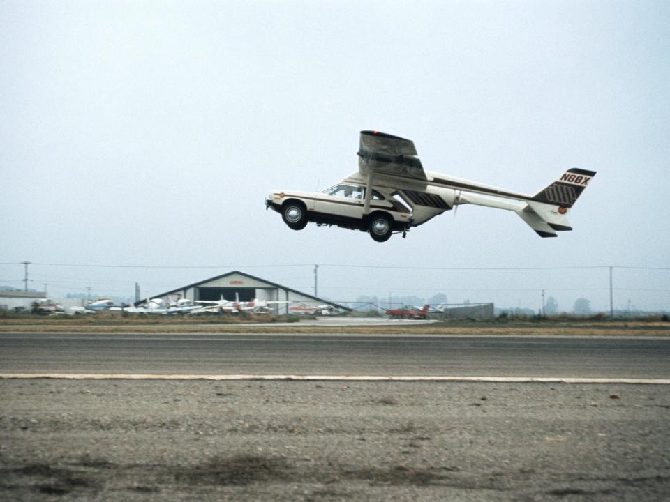 The AVE Mizar taking flight on an empty stretch of airport runway