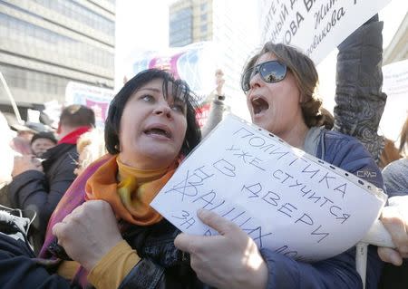 Residents attend a demonstration to protest against the decision by authorities to demolish soviet five-storey houses in Moscow, Russia, May 14, 2017. REUTERS/Sergei Karpukhin