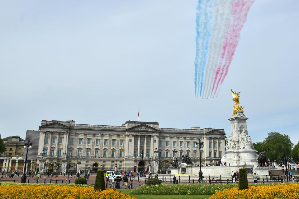 The Royal Air Force Red Arrows pass over Buckingham Palace in London during a flypast in central London to mark the 75th anniversary of VE Day. (Photo by Dominic Lipinski/PA Images via Getty Images)