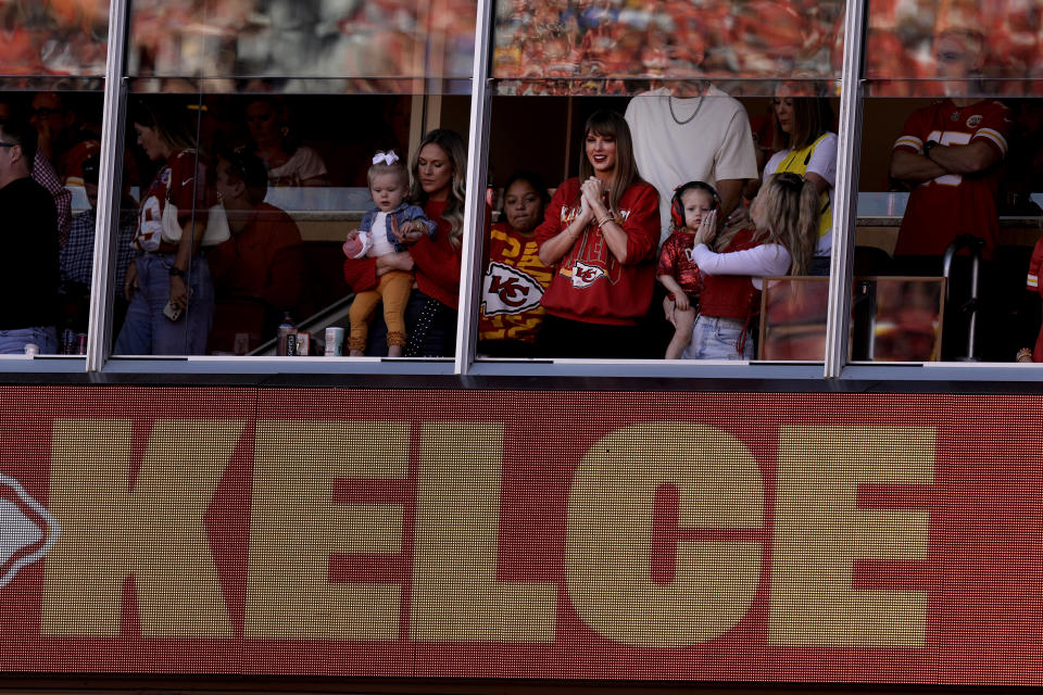 Taylor Swift watches from a suite during the first half of an NFL football game runs with the ballt Sunday, Oct. 22, 2023, in Kansas City, Mo. (AP Photo/Charlie Riedel)