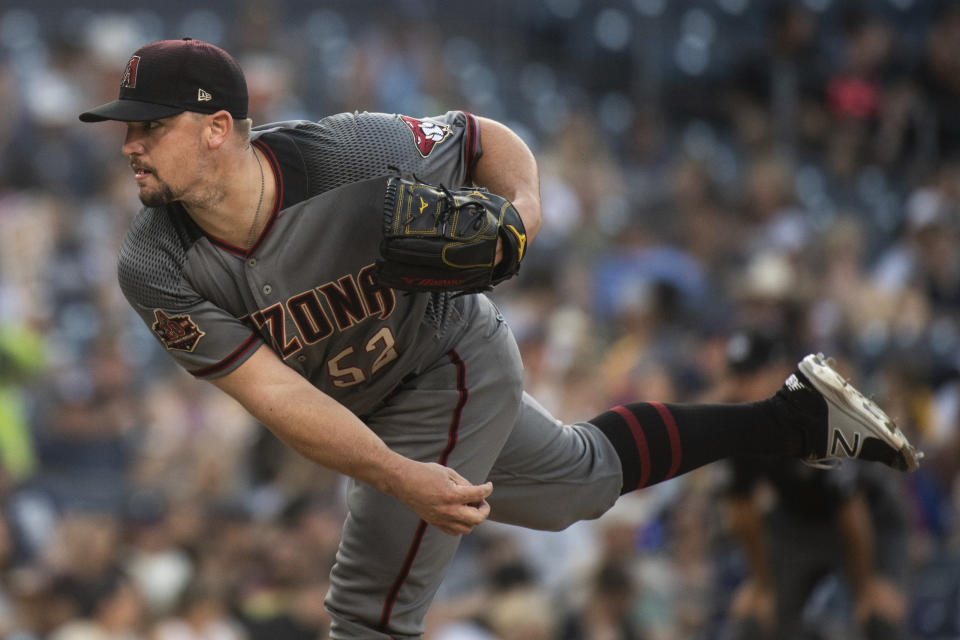 Arizona Diamondbacks starting pitcher Zack Godley delivers a pitch during the third inning of a baseball game against the San Diego Padres in San Diego, Saturday, Aug. 18, 2018. (AP Photo/Kyusung Gong)