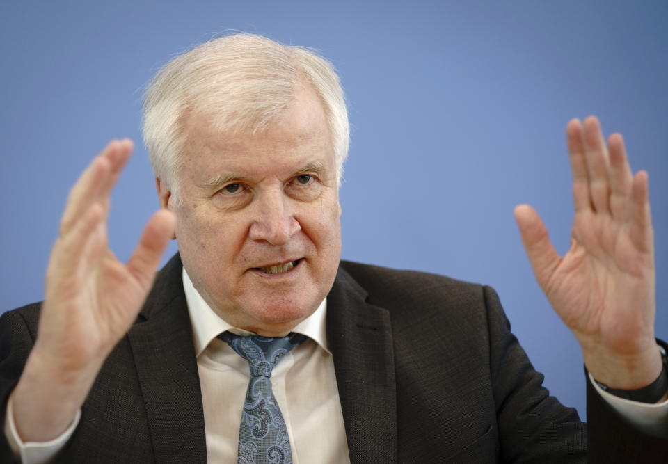 Horst Seehofer (CSU), Federal Minister of the Interior, for Construction and Home Affairs, presents the case figures of politically motivated crime for the year 2020 at the Federal Press Conference in Berlin, Germany, Tuesday, May 4, 2021. (Kay Nietfeld/dpa via AP)