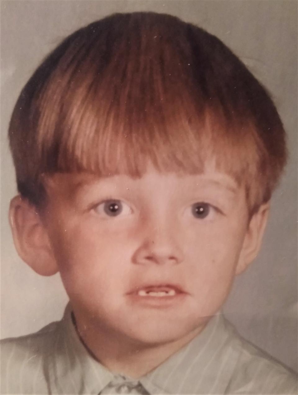 Tom O'Neill in first grade. His shirt is a size too big to accommodate the cast on his arm.