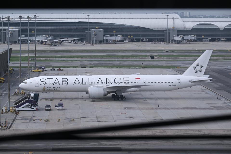 The Singapore Airlines flight SQ321, which was headed to Singapore from London before making an emergency landing in Bangkok due to severe turbulence, is seen on the tarmac at the Suvarnabhumi International Airport in Bangkok on 22 May 2024 (AFP via Getty Images)