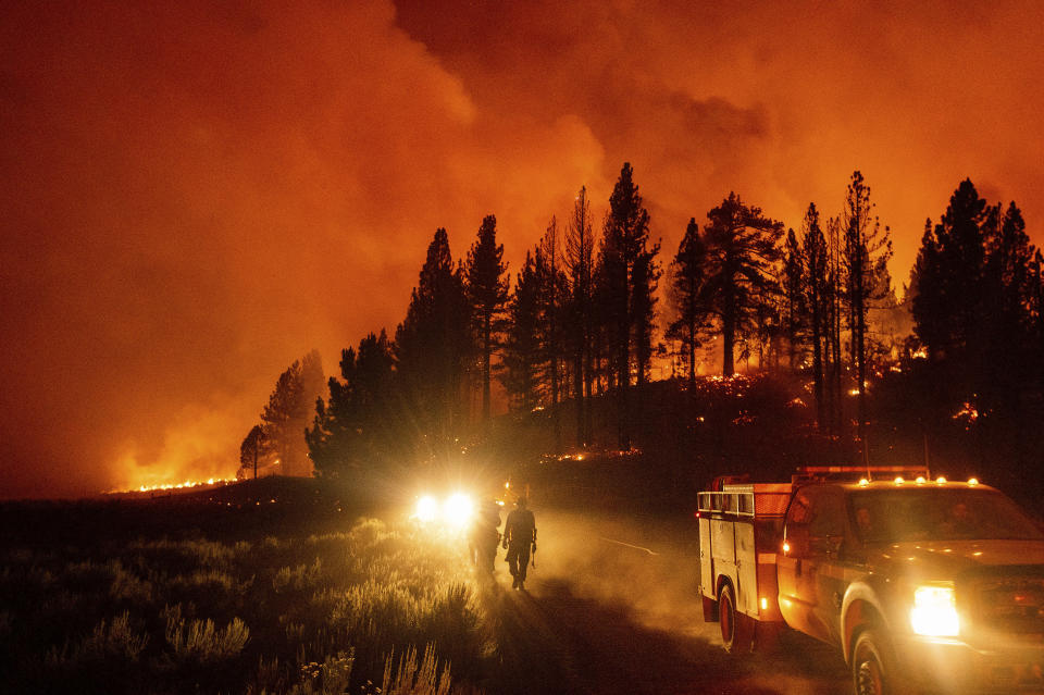 Firefighters battle the Sugar Fire, part of the Beckwourth Complex Fire, burning in Plumas National Forest, Calif., Thursday, July 8, 2021. (AP Photo/Noah Berger)