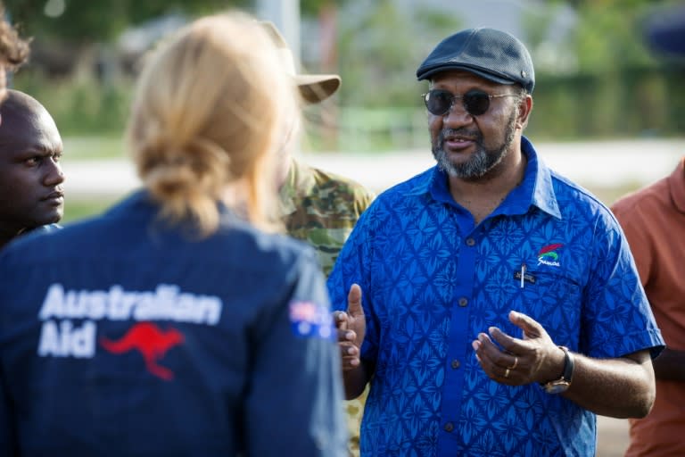 A handout photo from the Australian Defence Force shows Prime Minister of Vanuatu Charlot Salwai (R) passing his thanks to the Deputy High Commissioner for Operation Vanuatu Assist 2017