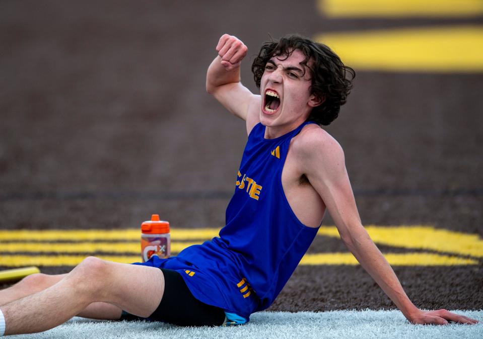 Castle’s Deacon Sawyer celebrates after finishing the 4x800 relay to set a new record during the 2024 IHSAA Boys Track & Field Sectional 32 at Central High School Thursday, May 16, 2024.