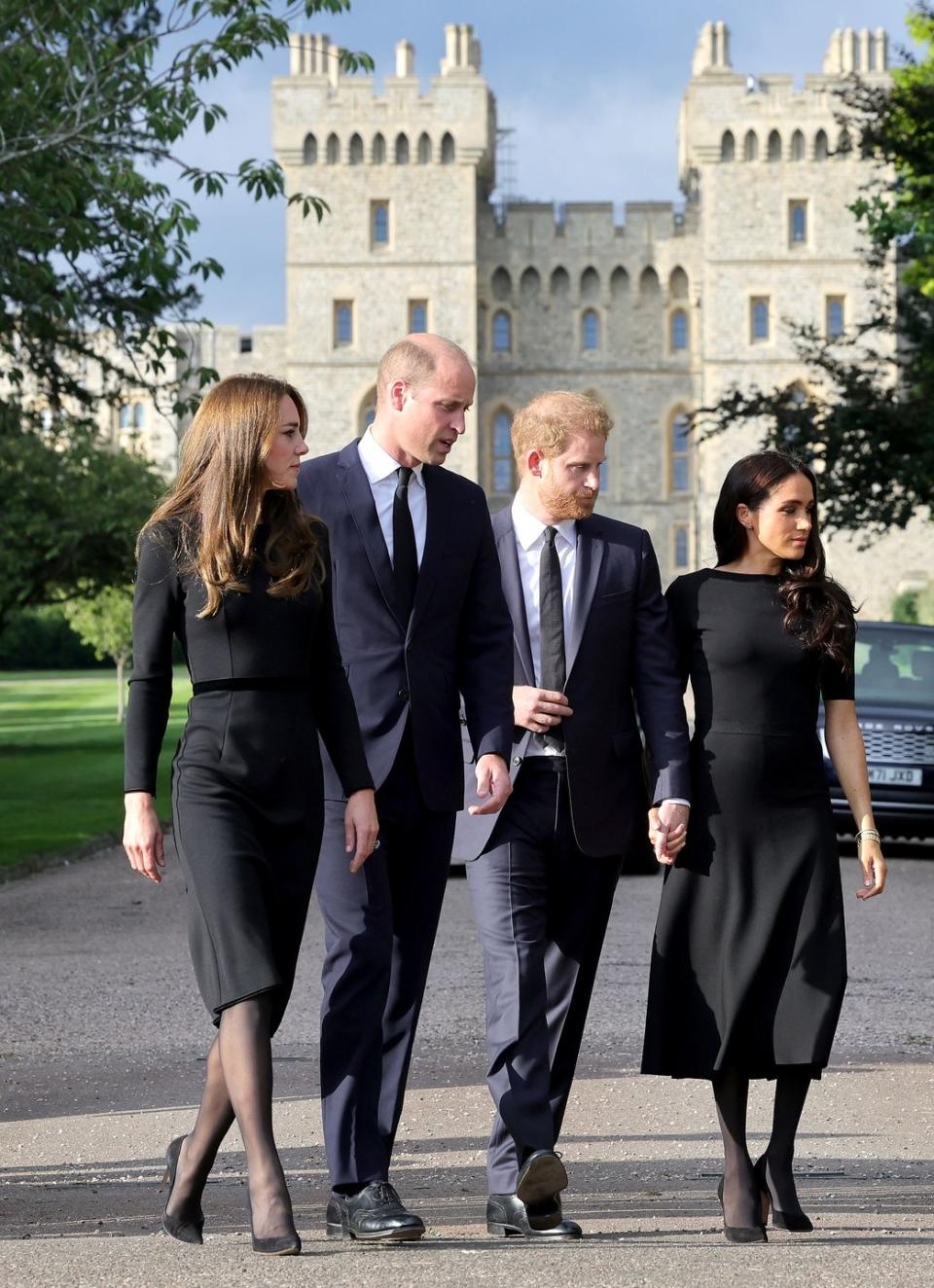 the prince and princess of wales accompanied by the duke and duchess of sussex greet wellwishers outside windsor castle