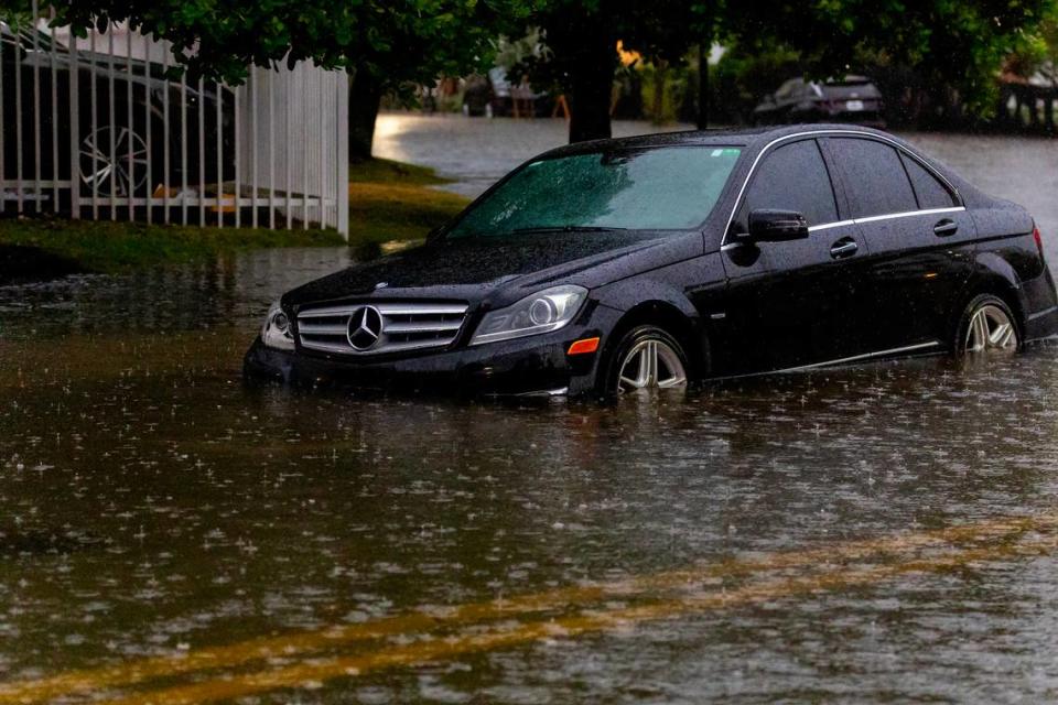 A vehicle stranded by the flooded road due to heavy rain at North Bay Rd and 180th Dr. in Sunny Isles Beach on Wednesday, June 12, 2024 in Florida.