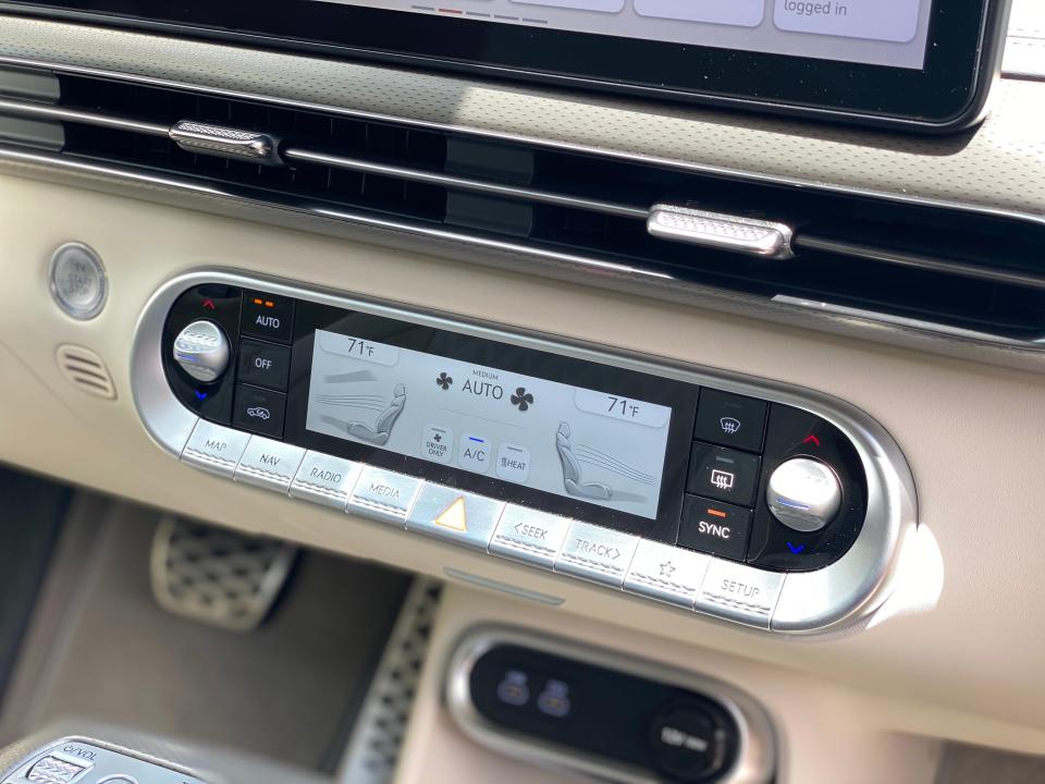 The climate control display on the front dash of a 2024 Genesis GV60 EV.