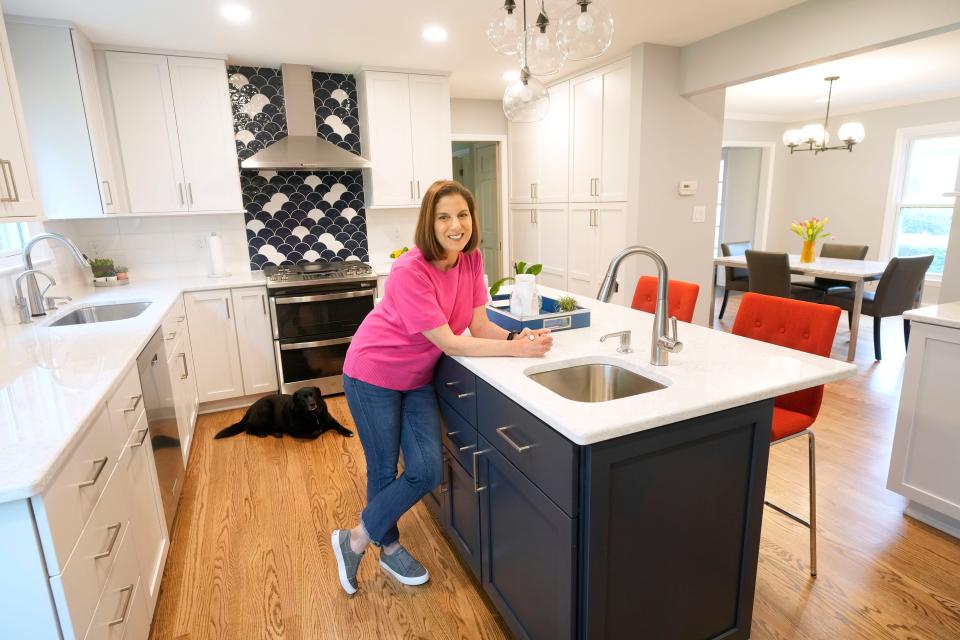 More than three months after her remodeling project started, Joan Kazan cherishes the bright and organized kitchen on May 26. Otis the dog is feeling at home, too.