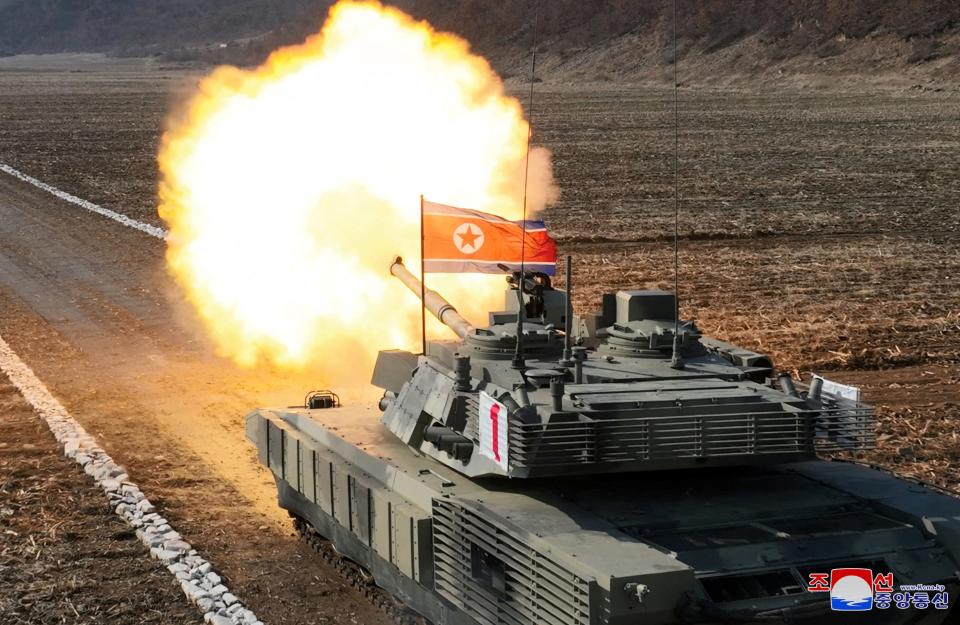A North Korean tank fires during a military demonstration.