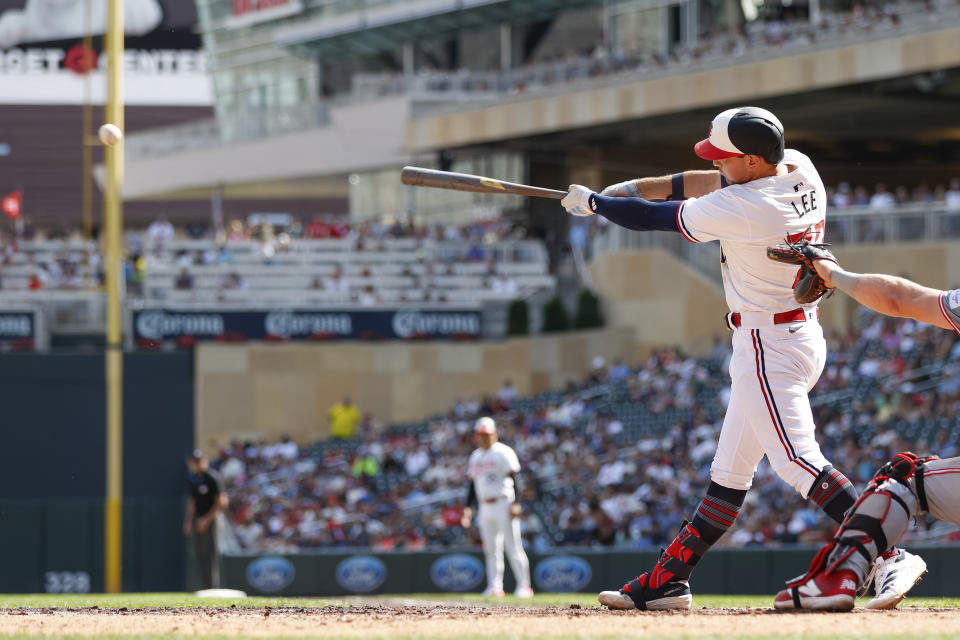 Minnesota Twins' Brooks Lee hits a two-RBI single in the sixth inning of a baseball game against the Cincinnati Reds, Sunday, Sept. 15, 2024, in Minneapolis. (AP Photo/Bailey Hillesheim)