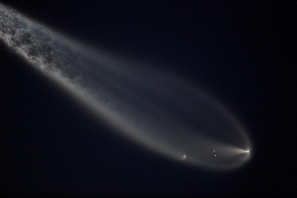 A SpaceX Falcon 9 rocket takes to the night sky for a timely liftoff at 8:32 pm from Cape Canaveral's Launch Complex 40 on May 17, 2024. The rocket's launch is seen at Vero Beach High School's graduation ceremony.  On board is the next batch of Starlink satellites, Starlink 6-59.