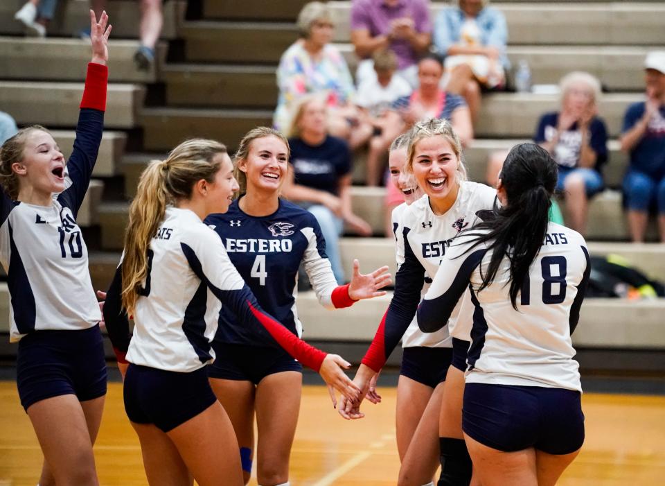 The Estero Wildcats celebrate a point during a game against the Riverdale Raiders at Estero High School on Tuesday, Oct. 3, 2023.