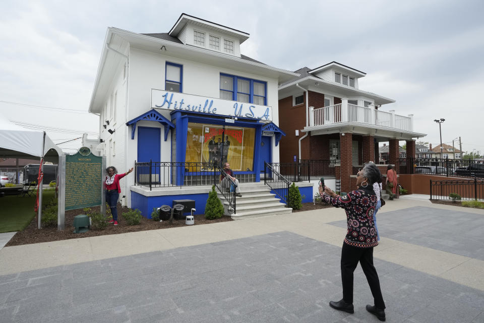 A visitor takes a photo outside of the Motown Museum, Friday, May 19, 2023, in Detroit. The museum welcomed the iconic soul group the Spinners to Hitsville U.S.A. in Detroit where group members donated uniforms and other memorabilia from their Motown days. (AP Photo/Carlos Osorio)