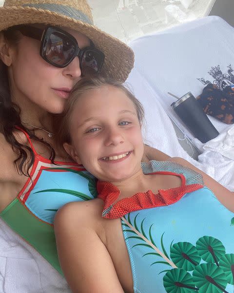 <p>Bethenny Frankel celebrated Mother's Day 2021 with an <a href="https://www.instagram.com/p/COp8aUZhtkz/" rel="nofollow noopener" target="_blank" data-ylk="slk:Instagram post captioned;elm:context_link;itc:0;sec:content-canvas" class="link ">Instagram post captioned</a>, "The bond between a mother and a child is infinite. It defines me, gives me purpose and is my true compass." </p> <p>In one photo, she and her daughter twin in matching one-piece bathing suits. </p>