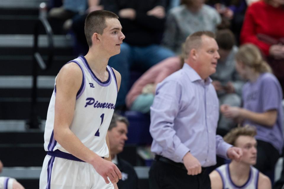 Cooper Lewis, left, and coach Quincy Lewis, right, look on during a game against Pleasant Grove at Lehi High in Lehi on Friday, Jan. 26, 2024. Lehi won 77-61. | Marielle Scott, Deseret News