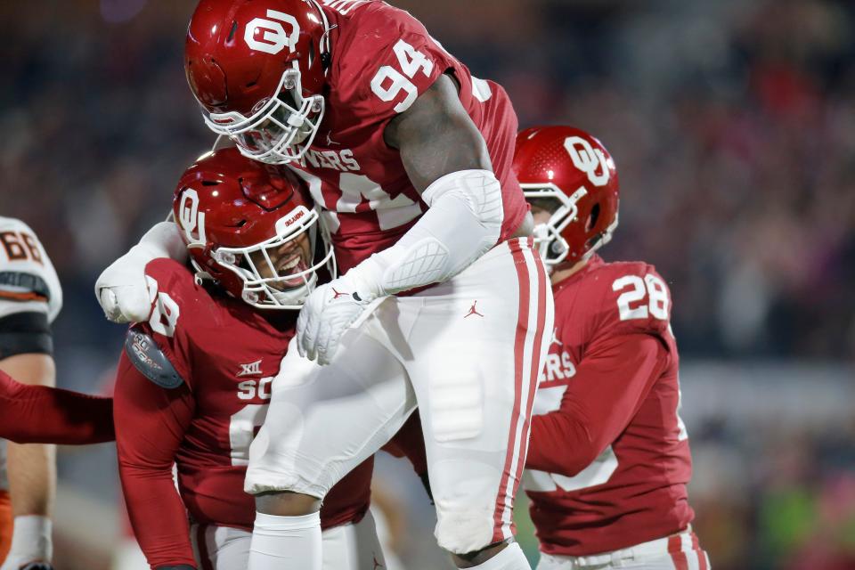 Oklahoma's Jordan Kelley (88) celebrates with Isaiah Coe (94) after a sack during a Bedlam college football game between  the University of Oklahoma Sooners (OU) and the Oklahoma State University Cowboys (OSU) at Gaylord Family-Oklahoma Memorial Stadium in Norman, Okla., Saturday, Nov. 19, 2022. 