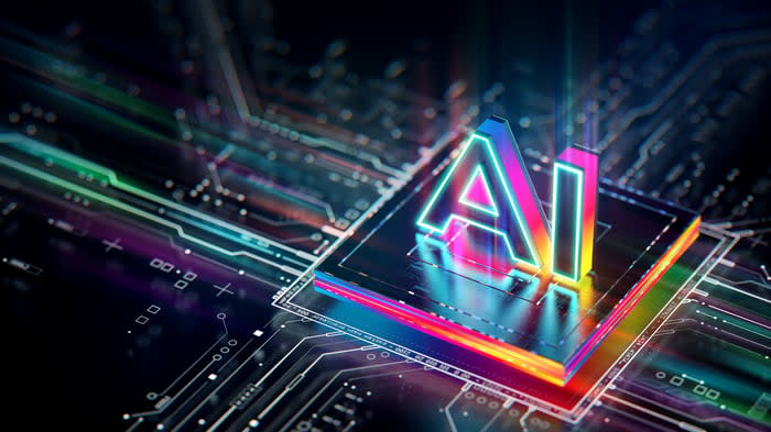 Graphic of an integrated circuit on a printed circuit board with artificial intelligence printed on top.