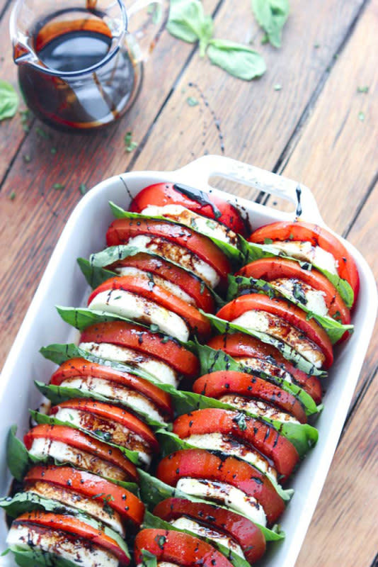 <p>Little Broken</p><p>The most festive summer tomato mozzarella salad with balsamic reduction. Make this as an appetizer or side and you’ll be the talk of the party! </p><p><strong>Recipe here: </strong><strong><a href="http://www.littlebroken.com/2015/02/21/tomato-mozzarella-salad-with-balsamic-reduction/" rel="nofollow noopener" target="_blank" data-ylk="slk:Tomato-Mozzarella Salad with Balsamic Reduction;elm:context_link;itc:0;sec:content-canvas" class="link ">Tomato-Mozzarella Salad with Balsamic Reduction</a></strong></p>