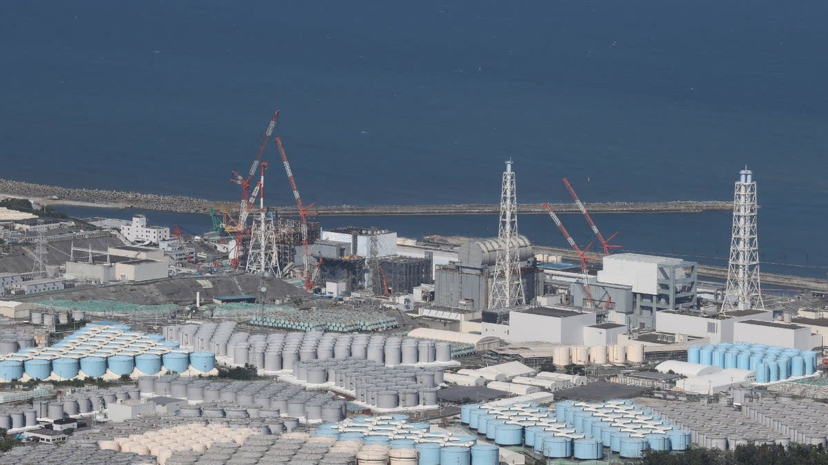 This aerial picture shows storage tanks used for storing treated water at Tepco’s crippled Fukushima Daiichi Nuclear Power Plant in Okuma, Fukushima prefecture on 24 August 2023 (via Getty Images)
