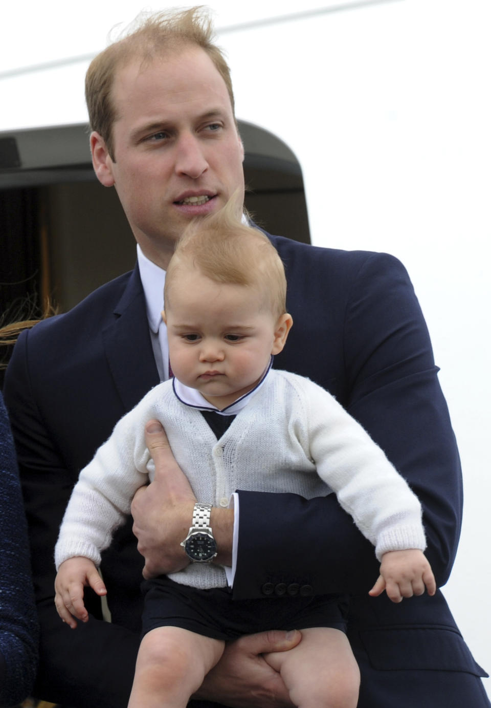 Britain's Prince William carries his son Prince George as they depart for Sydney, Australia, from Wellington, New Zealand, Wednesday, April 16, 2014. (AP Photo/SNPA, Ross Setford) NEW ZEALAND OUT