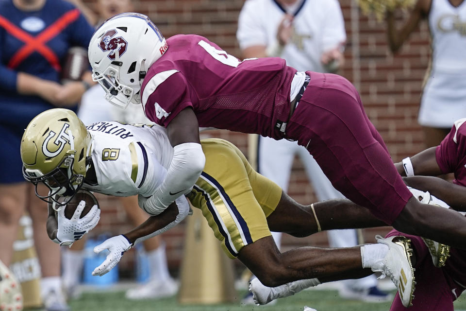 Georgia Tech wide receiver Malik Rutherford (8) is hit by South Carolina State defensive back Demarkiis Doe (4) during the first half of an NCAA college football game, Saturday, Sept. 9, 2023, in Atlanta. (AP Photo/Mike Stewart)