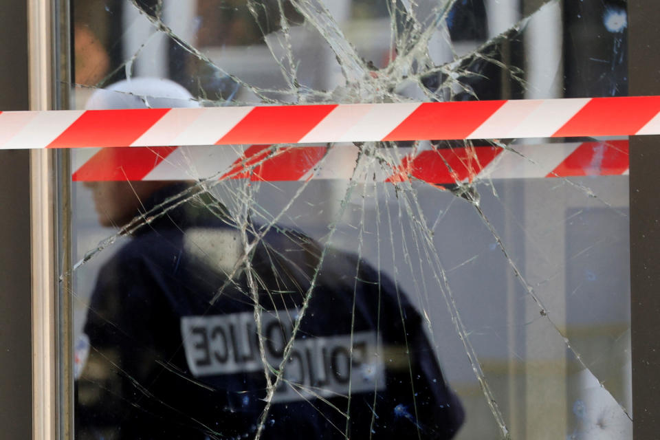 French police secure the area at the city hall of Mons-en-Barœul, near Lille, damaged during night clashes between protesters and police, on June 29. 2023.<span class="copyright">Pascal Rossignol—Reuters</span>