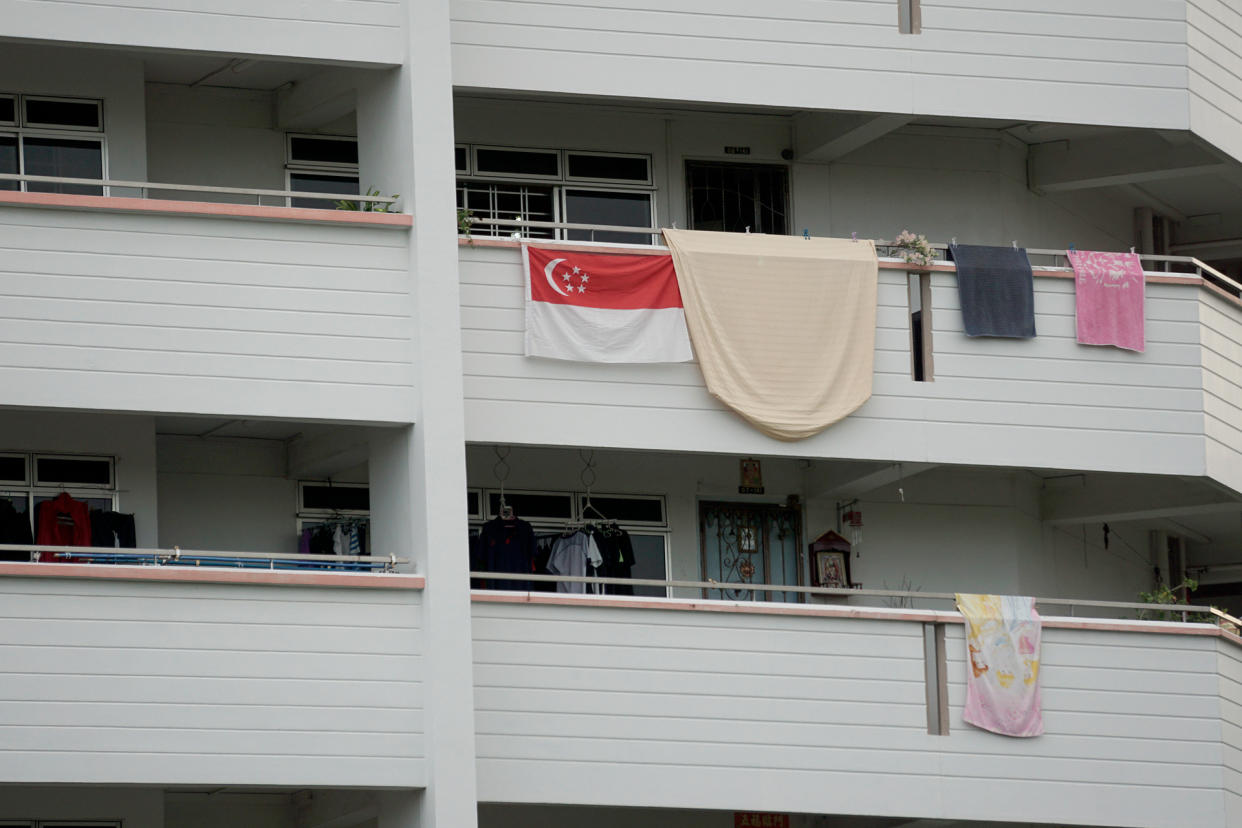 A Singapore flag seen hanging outside a HDB flat. (PHOTO: Dhany Osman / Yahoo News Singapore)