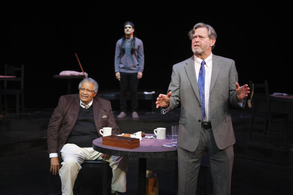 This image shows Count Sovall, left, and John L. Payne during a performance of "American Rot," playing through March 31 at the Ellen Stewart Theatre in New York. (Steven Pisano/Sam Rudy Public Relations via AP)