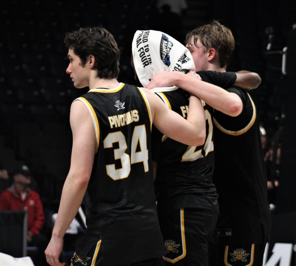 NKU fifth-year senior Trevon Faulkner (middle) is comforted by teammates Hubertas Pivorius (left) and Sam Vinson (right) as they walk off the floor following the game, as Northern Kentucky fell to Houston 63-52 in the first round of the NCAA Tournament March 16, 2023, at Legacy Arena, Birmingham, Alabama.