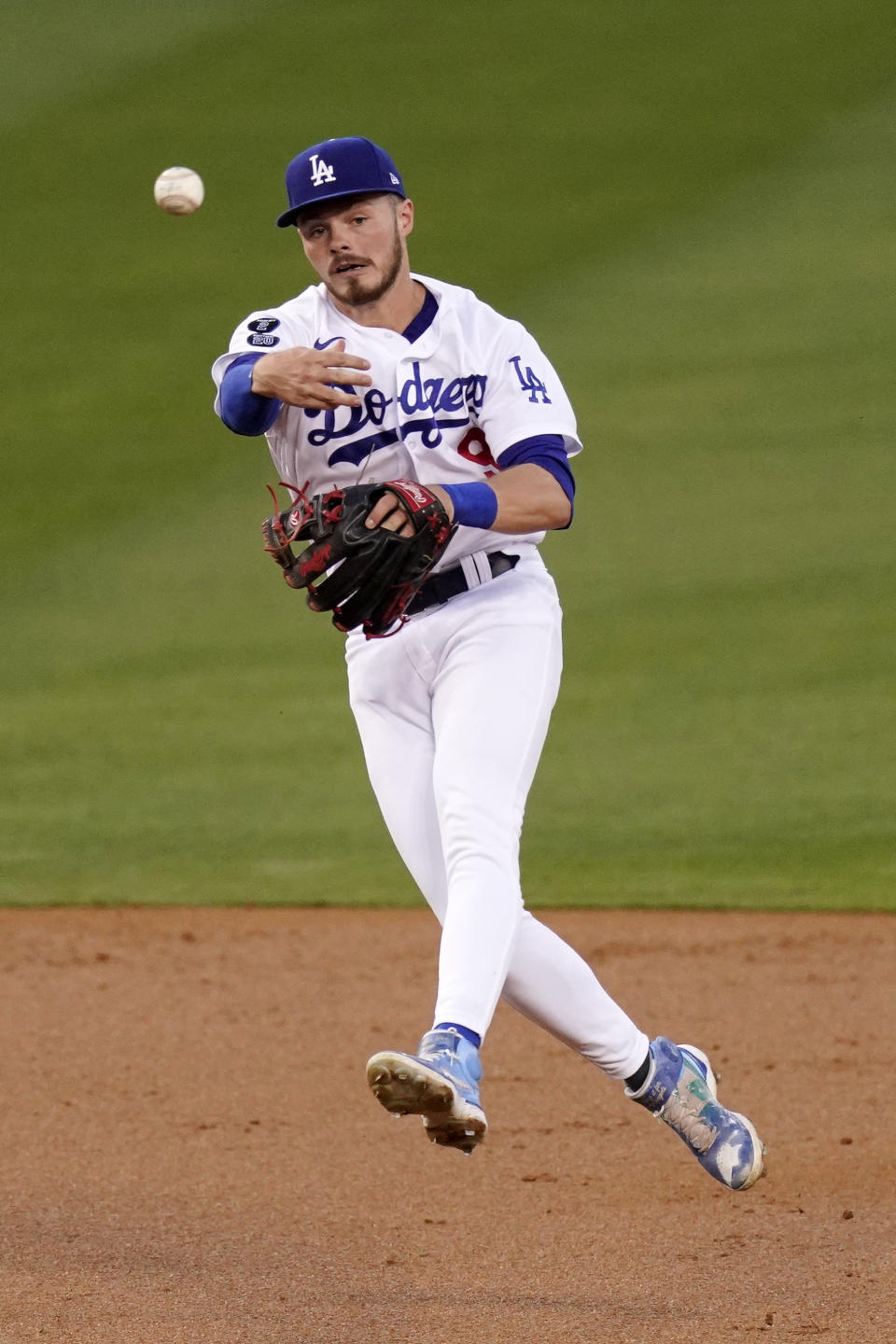 Los Angeles Dodgers second baseman Gavin Lux throws out Seattle Mariners' Dylan Moore at first during the second inning of an interleague baseball game Tuesday, May 11, 2021, in Los Angeles. (AP Photo/Mark J. Terrill)