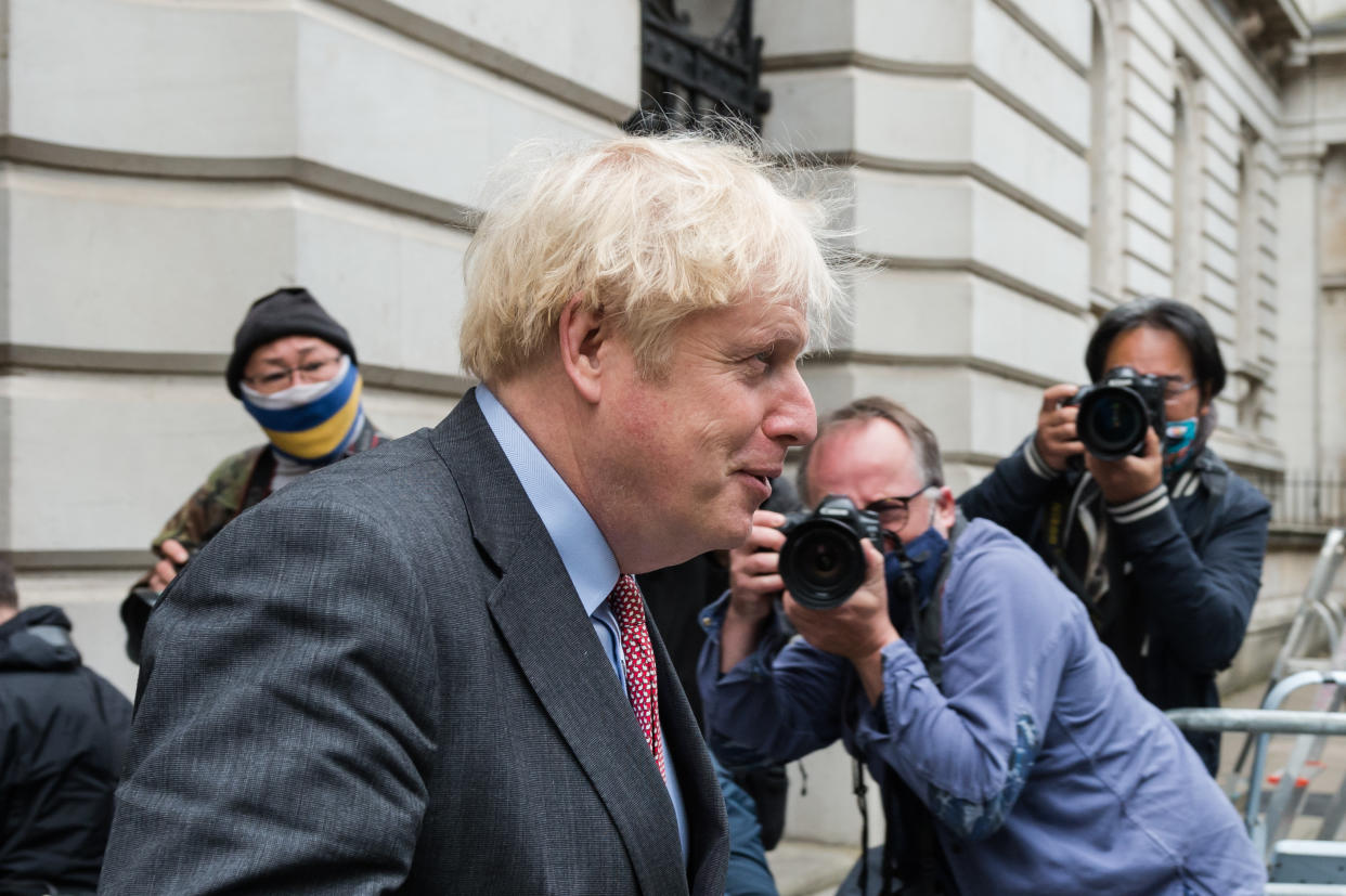 LONDON, UNITED KINGDOM - SEPTEMBER 30, 2020: British Prime Minister Boris Johnson returns to Downing Street in central London after attending weekly Cabinet meeting temporarily held at the Foreign Office to comply with social distancing guidelines due to the ongoing coronavirus pandemic, on 30 September, 2020 in London, England.- PHOTOGRAPH BY Wiktor Szymanowicz / Barcroft Studios / Future Publishing (Photo credit should read Wiktor Szymanowicz/Barcroft Media via Getty Images)