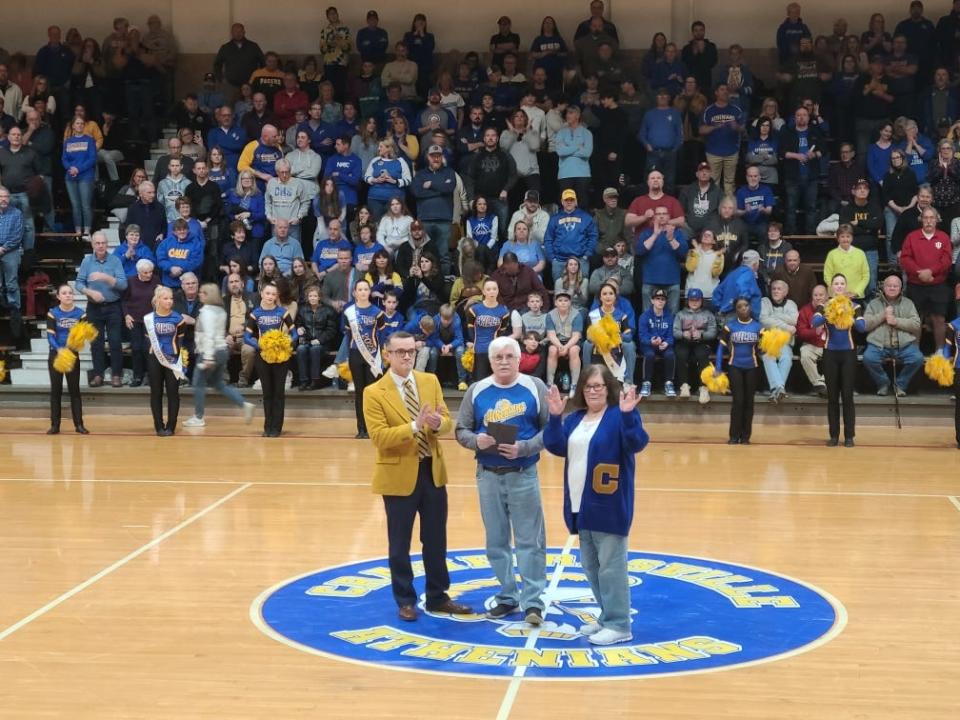 Crawfordsville coach David Pierce (left) with Mike Shubert and wife Jill who served basketball program for 28 years.