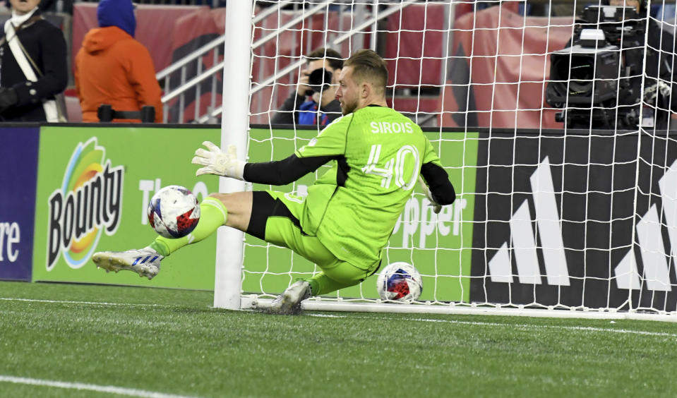 CF Montreal goalkeeper Jonathan Sirois (40) blocks the ball from the net in the first half of an MLS soccer match against the New England Revolution, Saturday, April 8, 2023, in Foxborough, Mass. (AP Photo/Mark Stockwell)