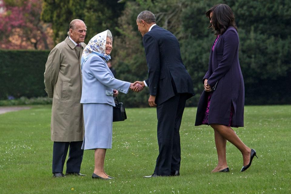 US President Barack Obama and his wife First Lady Michelle Obama are greeted by Queen Elizabeth II and Prince Phillip, Duke of Edinburgh after landing by helicopter at Windsor Castle for a private lunch on April 22, 2016 in Windsor, England.