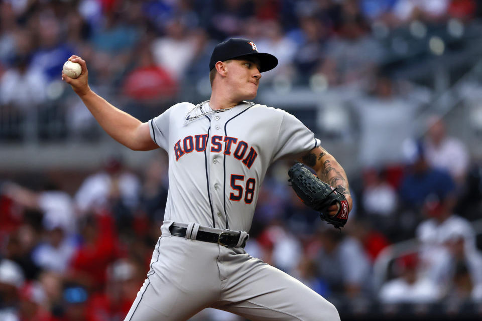 Houston Astros starting pitcher Hunter Brown throws during the first inning of the team's baseball game against the Atlanta Braves, Friday, April 21, 2023, in Atlanta. (AP Photo/Butch Dill)